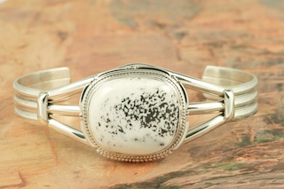 White Buffalo Turquoise set in Sterling Silver. This Beautiful Stone is formed from the minerals Calcite and Iron. It is mined near Tonopah Nevada. Created by Navajo Artist Kathy Yazzie. Signed by the artist.